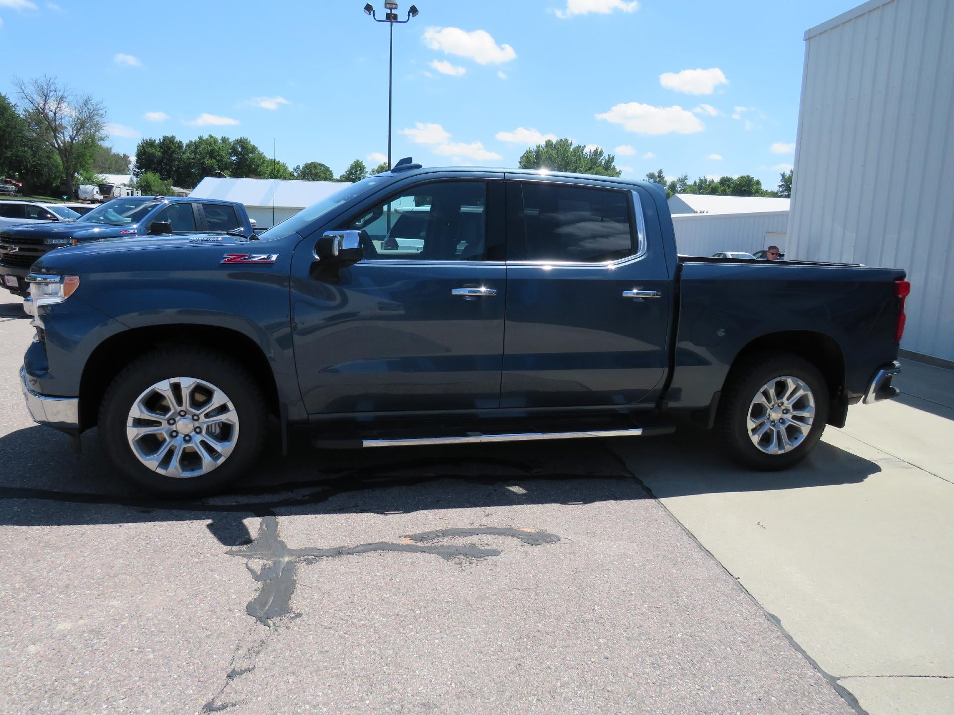 2024 Chevrolet Silverado 1500 LTZ in Lakeshore Blue Metallic — front three-quarter view