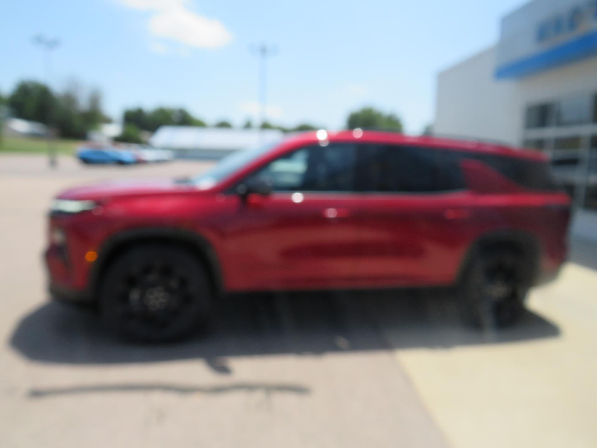 2026 Chevrolet Traverse RS in Radiant Red Tintcoat — front three-quarter view