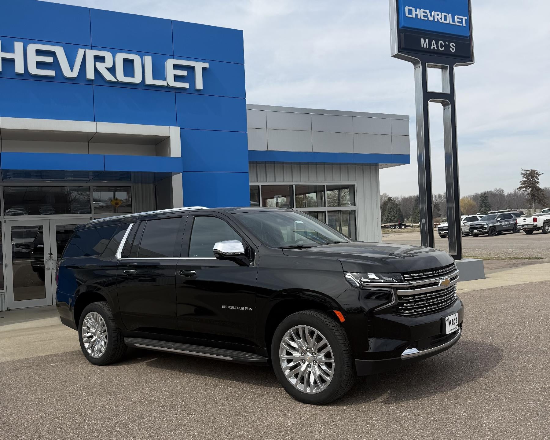 2024 Chevrolet Suburban Premier in Black — front three-quarter view